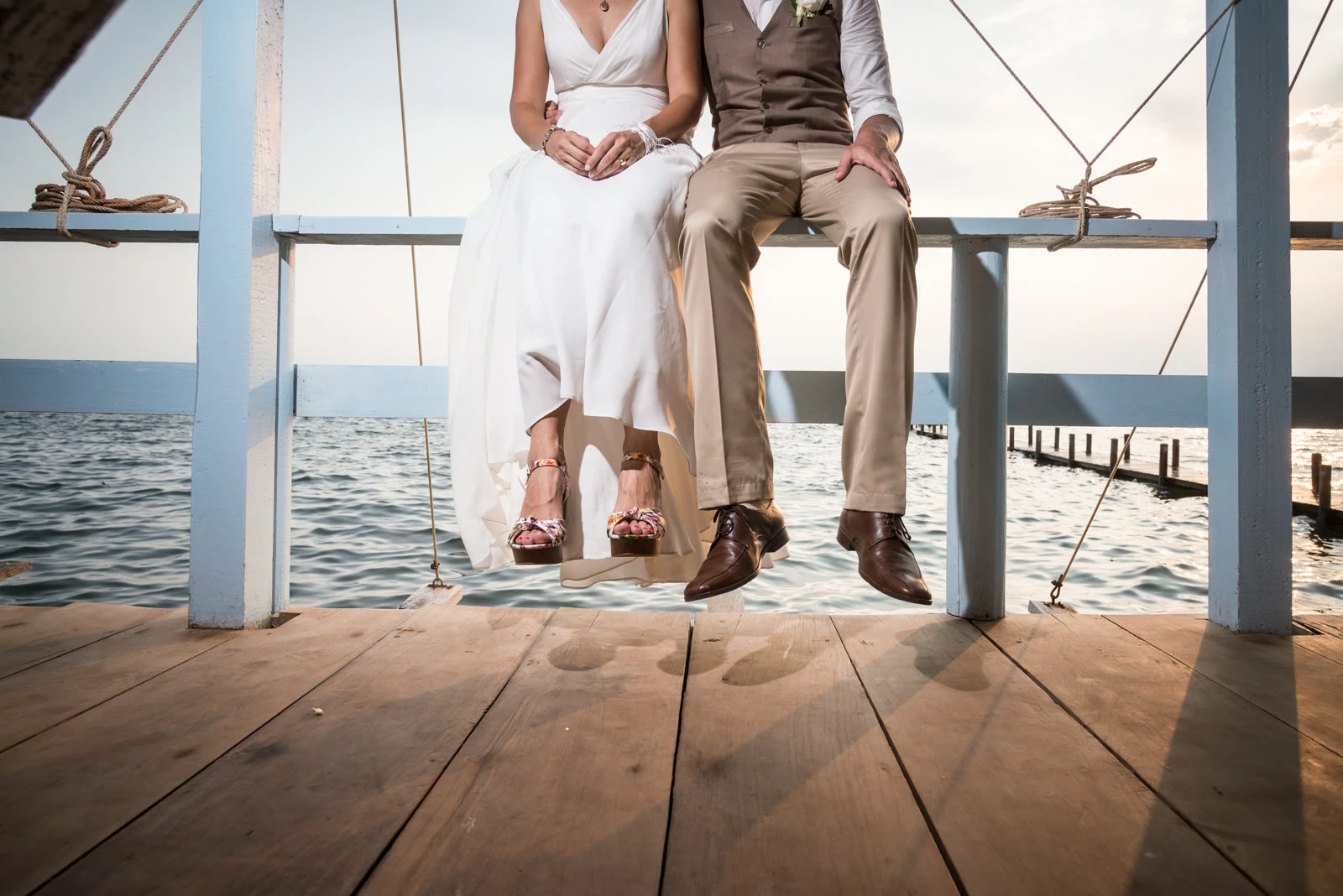 Bride and groom on the pier at Knai Bang Chatt
